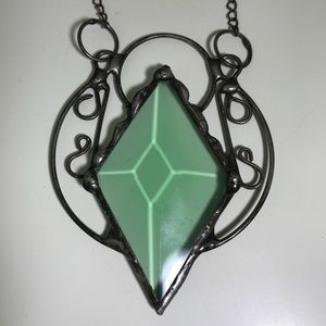Artisan made stained glass necklace.
